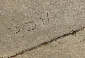 My dad's name in the pavement of the driveway next door. Coincidence? I think not.